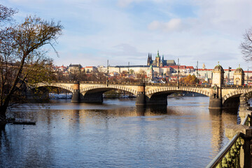 Fototapeta premium Snowy Prague Lesser Town with Prague Castle above River Vltava in the sunny Day , Czech republic