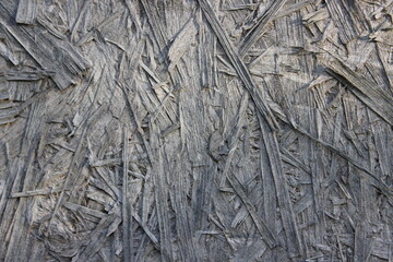 The texture of an old pressed wood panel. Macro . Russia.