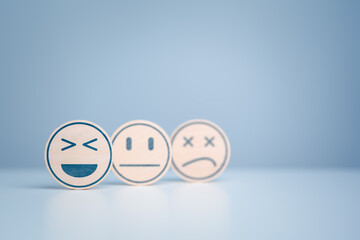 Wooden labels with happy normal and sad face icons for experience survey services and products...