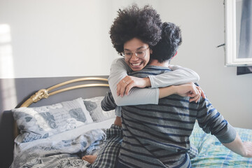 young multiethnic people bedroom having fun laughing tickling