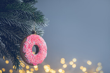 christmas toy in the form of a pink donut on the Christmas tree