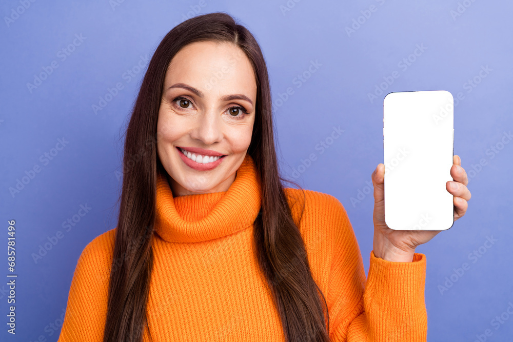 Sticker portrait of smiling young lady wearing orange knit turtleneck hold cellphone touchscreen web anti vi