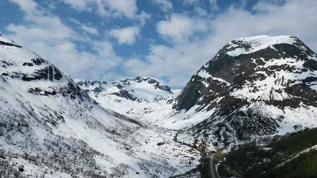 Snow covered mountains with tunnel filmed with a drone in 4K