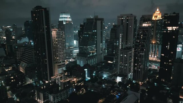 Epic drone footage of cinematic nighttime metropolis with towering skyscrapers. Aerial view cinematic beauty of a nocturnal megacity with iconic skyscrapers. Nighttime city vibes. Aerial drone shot