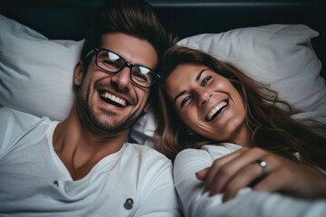 Beautiful happy young couple lying on bed and hugging, have a deep conversation with your partner in bed - Powered by Adobe