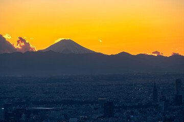 The Sun Setting behind Mt Fuji with Tokyo below as viewed from the Tokyo Skytree Tower, Tokyo, Japan