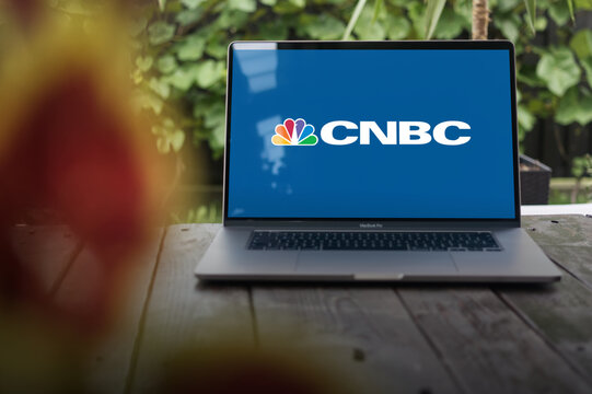 CNBC logo, American basic cable business news channel and website, displayed on MacBook Pro screen