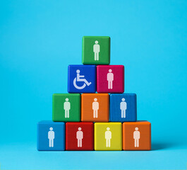 Inclusive workplace culture. Pyramid of colorful cubes with human icons and one with international...