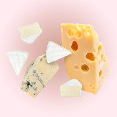 Different kinds of cheese falling on light pink background
