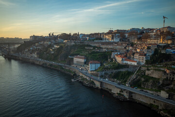 Fototapeta na wymiar Portugal, sunset in Porto over city and Douro River