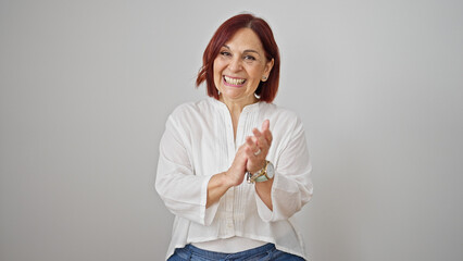 Middle age woman smiling confident clapping hands over isolated white background