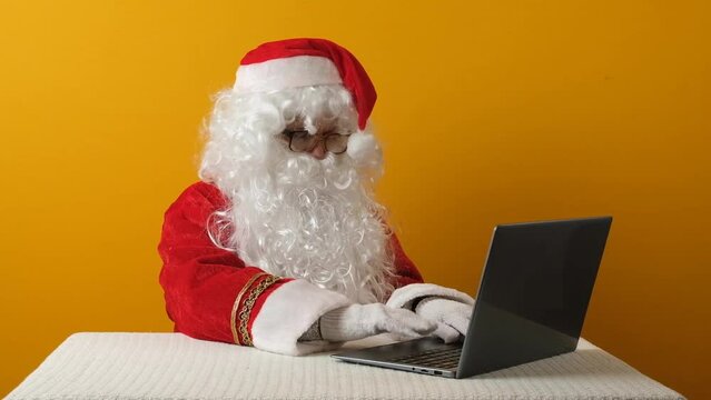 Santa Claus and laptop.