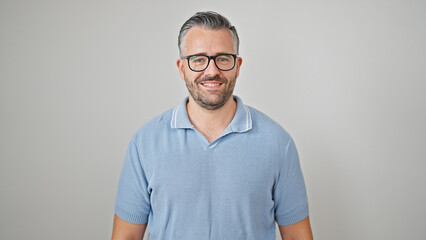 Grey-haired man smiling confident wearing glasses over isolated white background