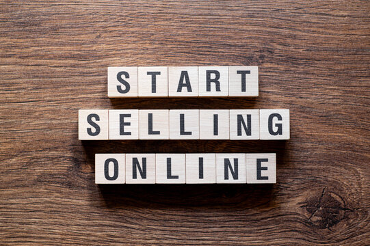 Start selling online - word concept on building blocks, text