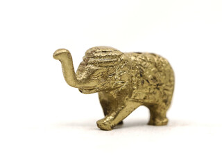 decorative elephant statue carved in bronze, ancient toy figure isolated in a white background