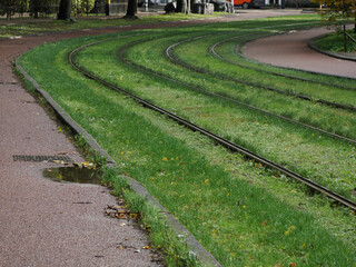 Amsterdam rail tracks in grass view on rainy day