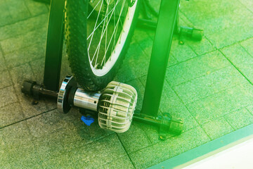 The rear wheel of the bicycle is used to rotate the power generator and generate electricity