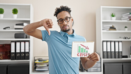 African american man business worker holding crisis chart doing thumb down gesture at office