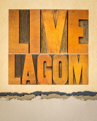 live lagom poster - word abstract in vintage letterpress wood type on art paper, Swedish balanced lifestyle and moderation concept