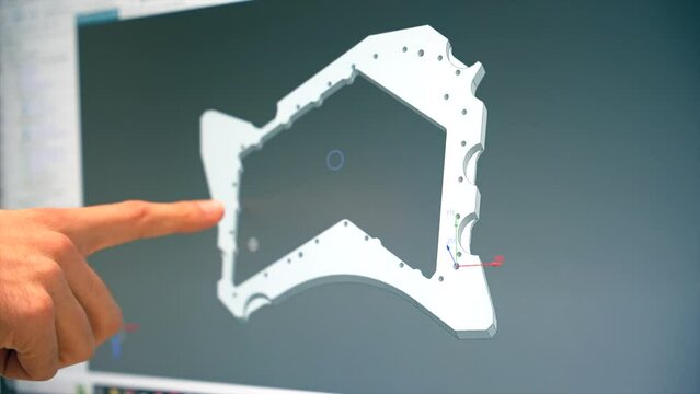 Engineers designing a metal piece in a computer