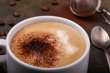 hot cappuccino with cocoa powder