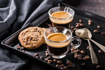 espresso coffee in glass cup and chocolate chip cookies - 685824426