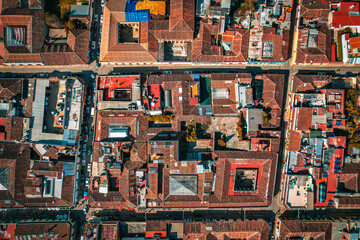 
Aerial perspective reveals a charming Mexican square, surrounded by colonial architecture, a...