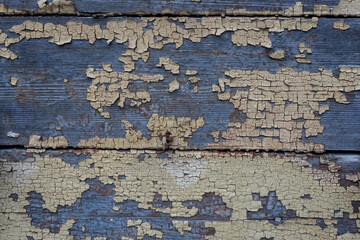 Selective focus photo. Old color on wooden house facade.