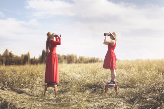 surreal images of two women with telescope facing each other, abstract concept