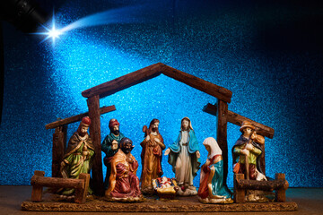 Christmas Manger scene with figurines including Jesus, Mary, Joseph