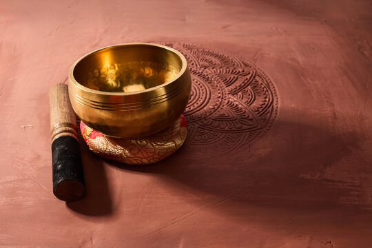 A close up of a tibetan singing bowl or himalayan bowl for therapy, meditation and relaxation.