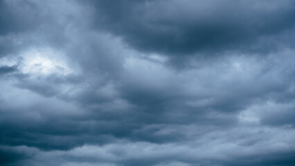 Overcast sky with dark clouds. Dark sky before a thunder-storm. The gray cloud background before...
