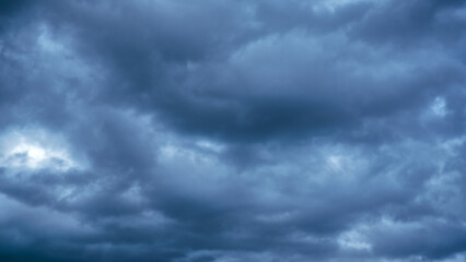 Overcast sky with dark clouds. Dark sky before a thunder-storm. The gray cloud background before...
