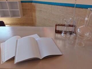 Chemistry office, teacher's desk, school desk, test tubes, chemical, experiments, chemistry, open notebook on the desk, laboratory work