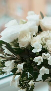 Bridal bouquet of white roses close-up, wedding decor and floristry