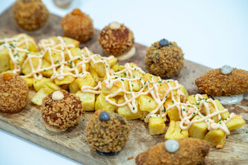 Table display with fries and croquettes