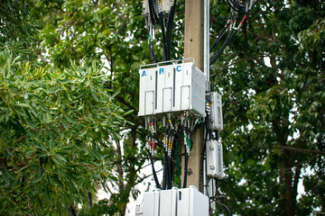 Telecommunication tower with blue sky and white clouds, technology background.