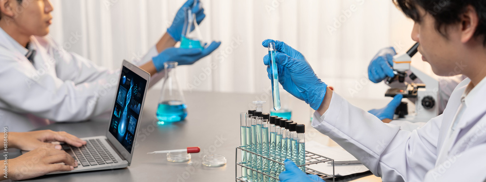 Poster dedicated scientist group working on advance biotechnology computer software to study or analyze dna