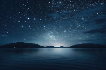 Obraz premium A stunning image of a night sky filled with twinkling stars reflecting on the calm surface of a body of water. Perfect for capturing the beauty of nature and the tranquility of the night.