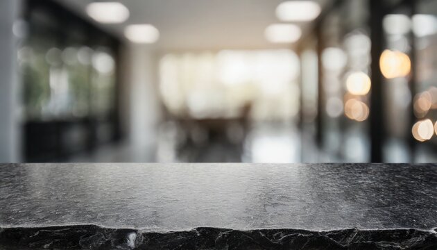 black stone table top and blurred bokeh office interior space background can used for display or montage your products