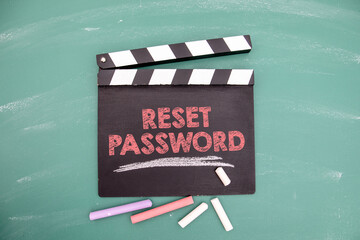 Reset password. Movie clapper and colored pieces of chalk