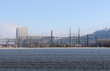 Electric power station on a frosty field in winter