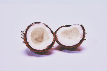 Coconut cut in a half isolated on light background. Organic products. Concept of nature, food, taste, tropical. Empty space to insert text