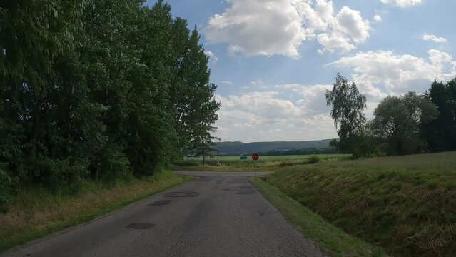 POV driving through forest and passing T junction or T intersection.