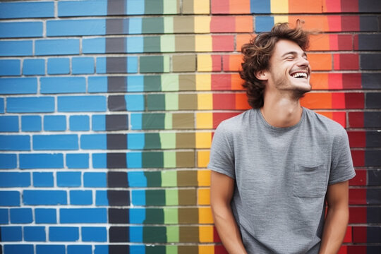 Vibrant Joy: Man Laughing Against Colorful Mosaic Wall