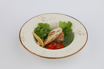 Grilled chicken fillet and fresh vegetable salad of lettuce and tomato. Healthy lunch menu. Diet food. Top view