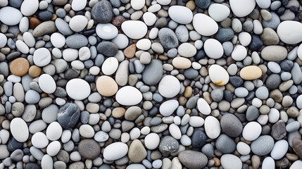 Abstract Shoreline: Capture an abstract composition of white pebbles arranged in dynamic patterns along the shoreline, with waves gently lapping against them