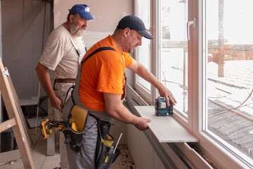 Concept Of Apartment Repair. Home renovation workers crew. Remodeling in the house (building) that...