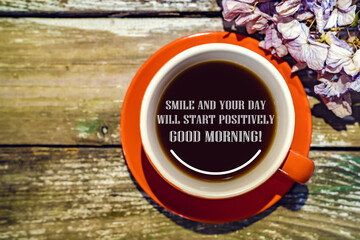 Mug with coffee on a wooden background, Hydrangea. Smile and your day will start positively. Good...