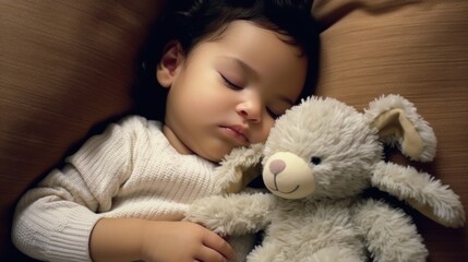 Baby rests on a contemporary sofa with a small cuddly toy.